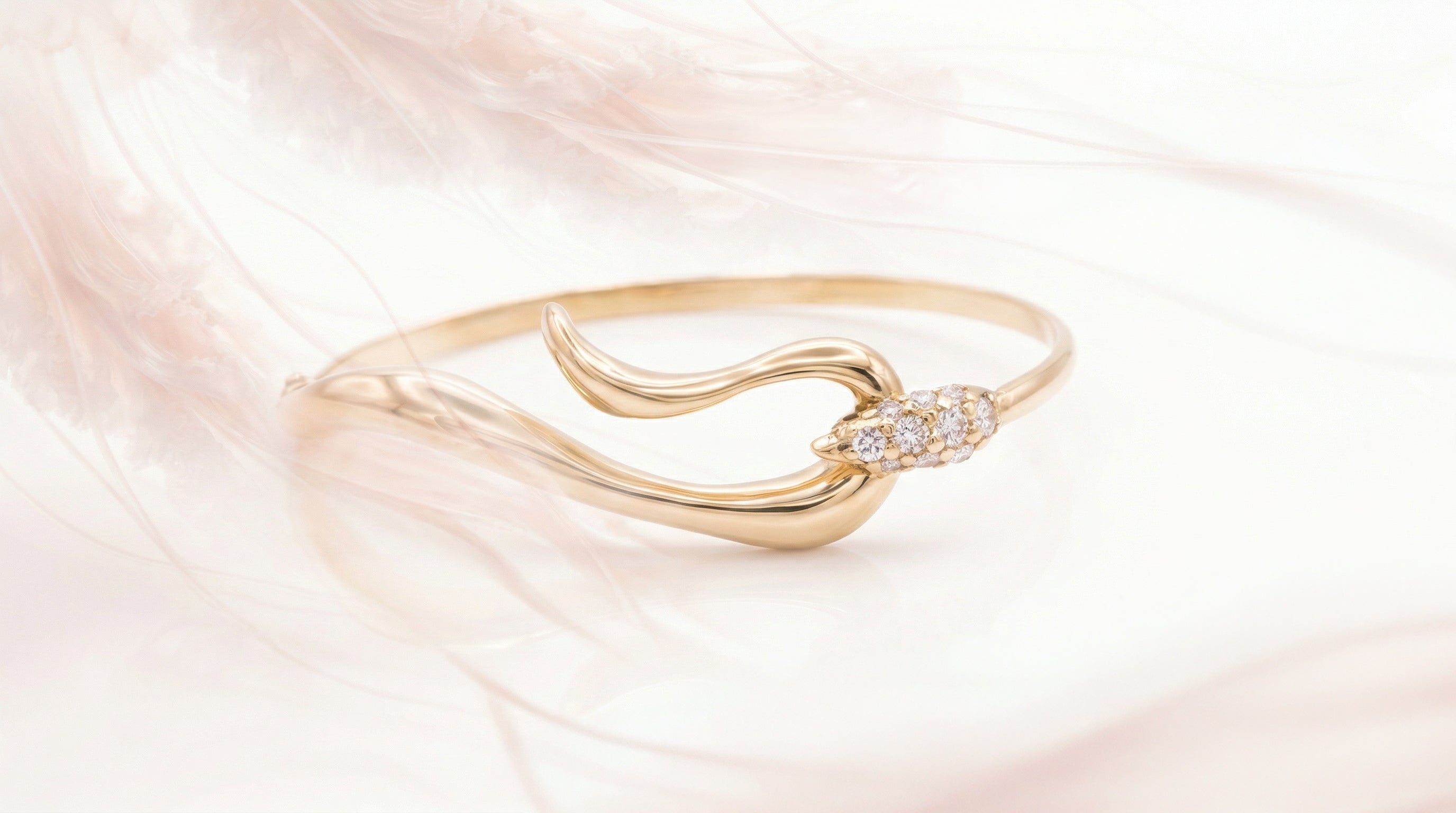Elegant gold bracelet with fluid shape and bright pave set diamonds